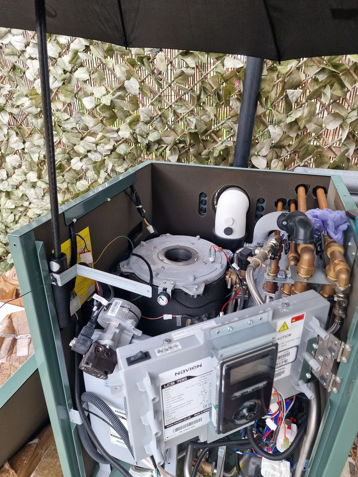 Close-up of an outdoor Novion oil boiler internals during fault-finding