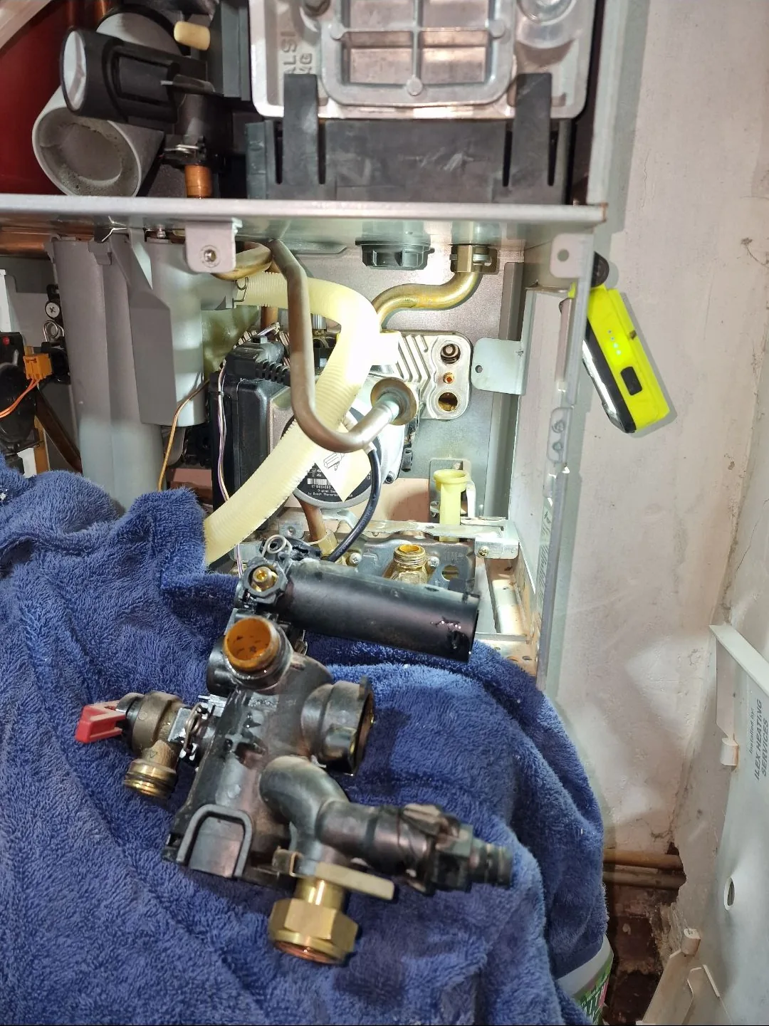 Diverter valve removed from a boiler during a repair, ready to be replaced